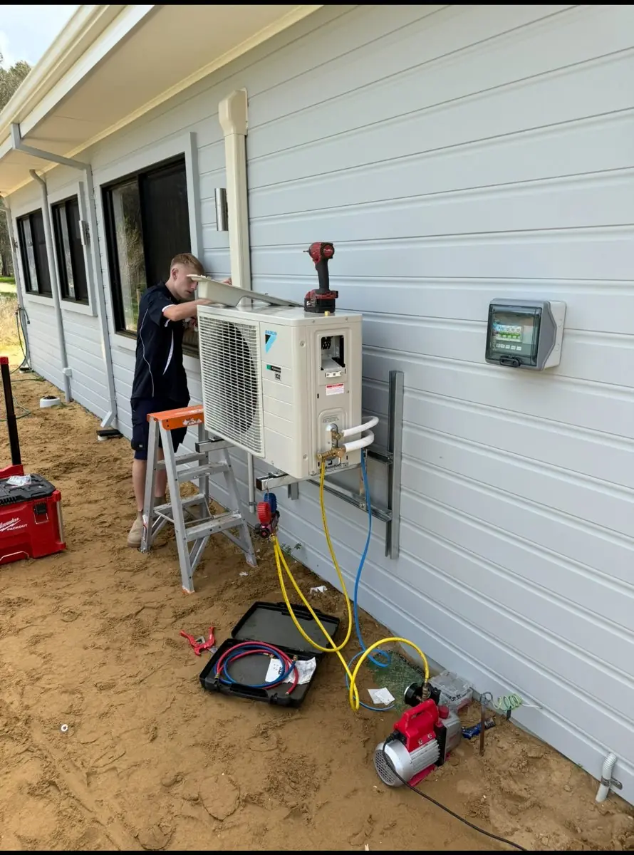 PPS apprentice commissioning a Daikin outdoor unit